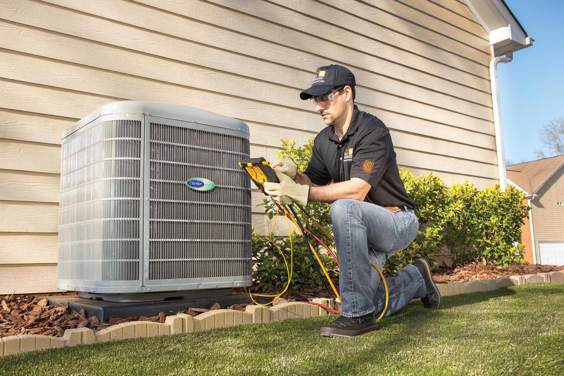 HVAC Installation Toluca Lake technician working on a system in a historic Colonial-style home