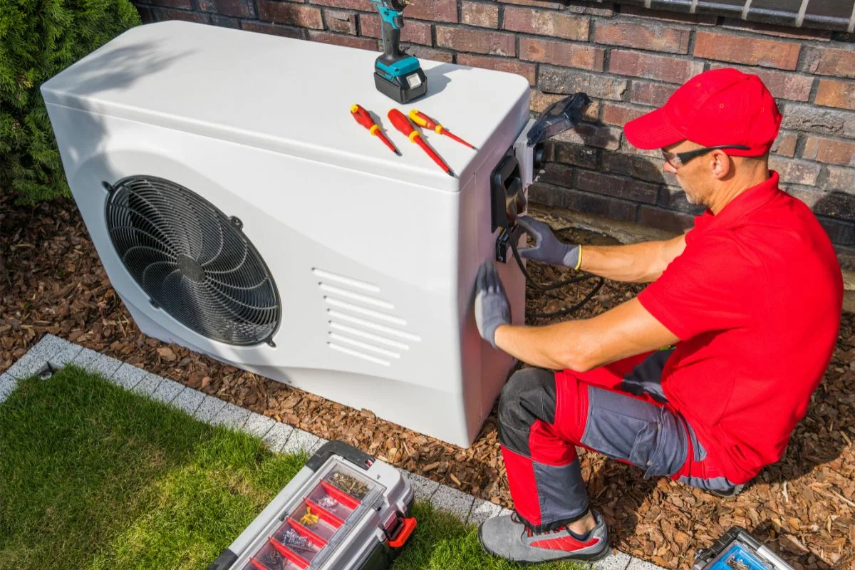 HVAC Experts technician repairing a cooling system during summer heat