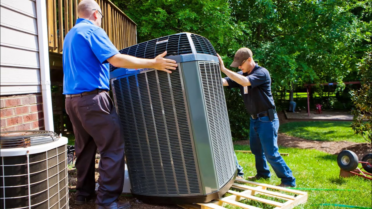Technician performing at a hillside home